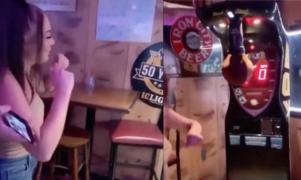 Γυναίκα δοκιμάζει τη δύναμή της στο παιχνίδι της γροθιάς